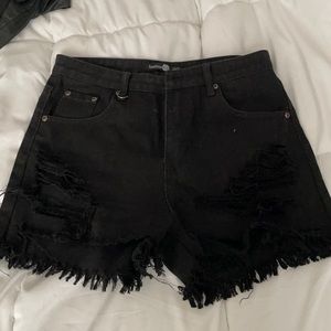 Distressed black jean shorts